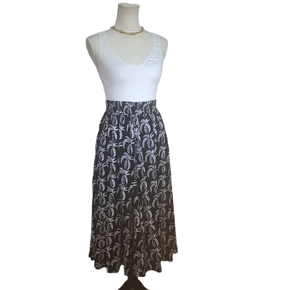 Carole Little. Vintage, Black A-Line Skirt w/ a white pineapple print. 6